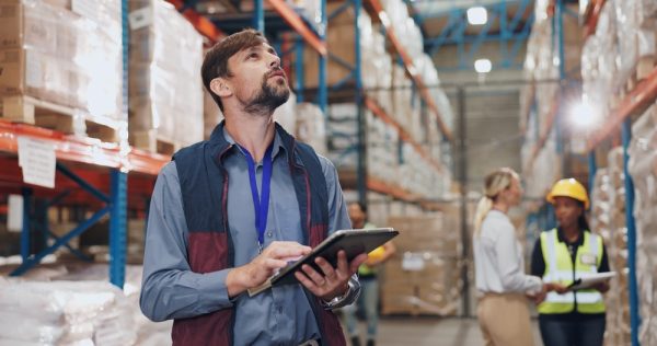 Man With Tablet In Warehouse For Stock