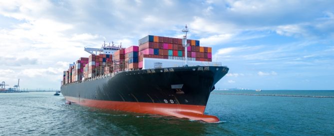 Aerial Side View Of Cargo Ship Carrying Containers
