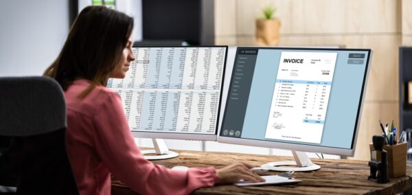 Invoice Accounting Software. Accountant Using Computer