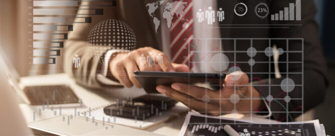 Businessman Using Digital Tablet Analyzes Business Data