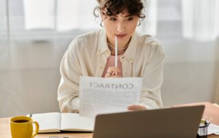 Business Woman Thoughtfully Reviews A Contract