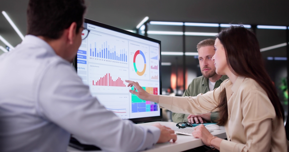 Businesswoman Managing Company Data Using Analytics Dashboard For Financial Performance.
